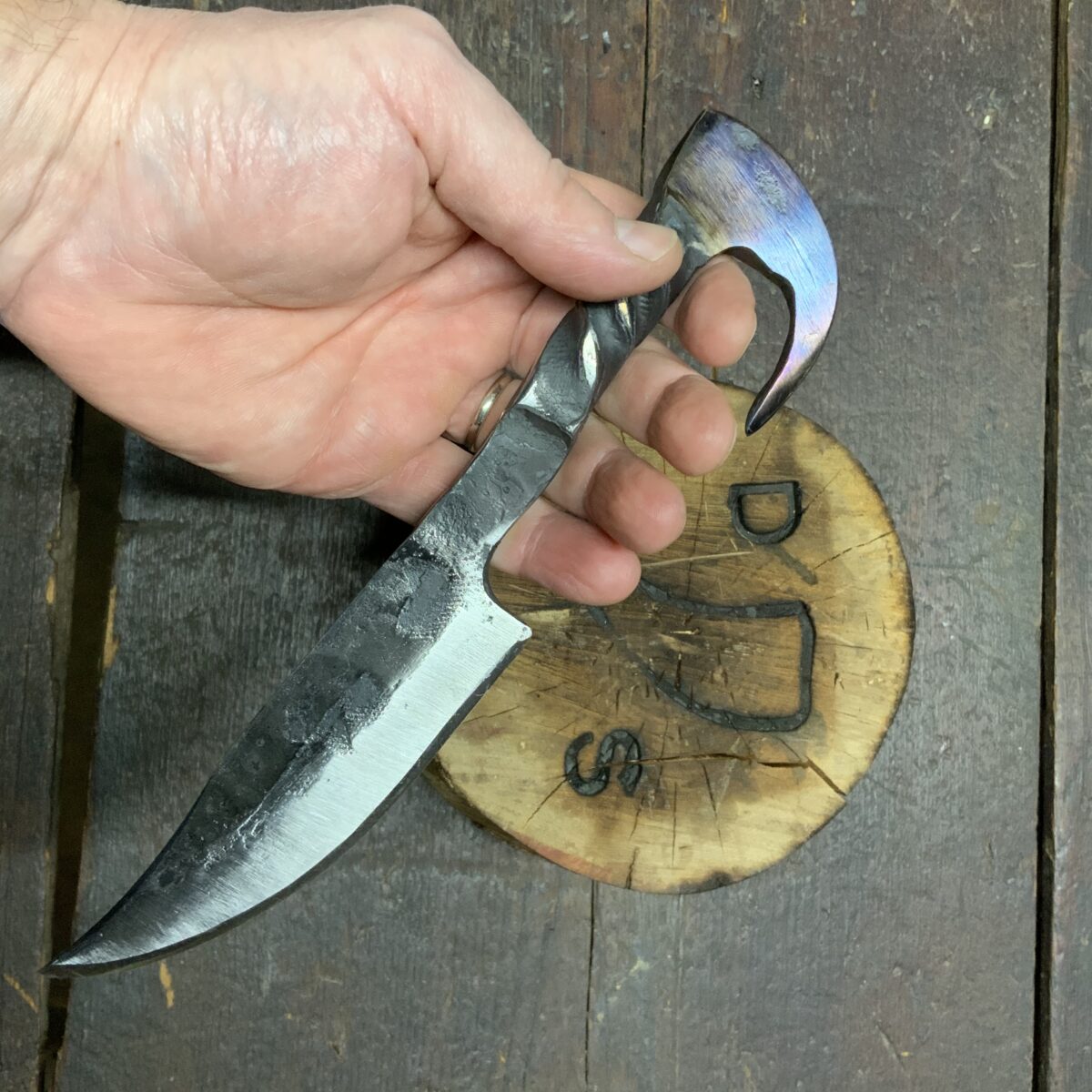 asding carbon to a railroad spike knife